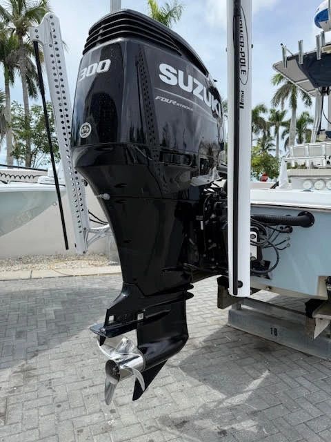 Suzuki 300 outboard motor at marine dealership