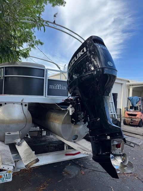 Black Suzuki 150 outboard motor repower